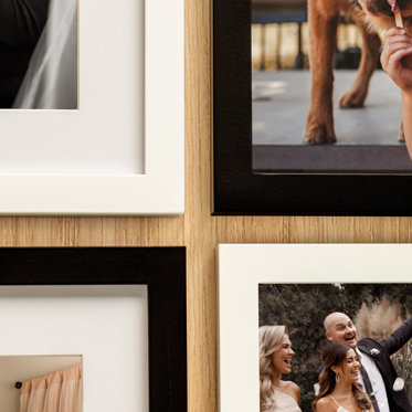 A collection of tabletop frames showcasing our black and white frames with or without window mat.