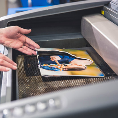 a photo statuette is made and being laser cut by a machine at our lab after the artist has selected the portion of the image to cut out