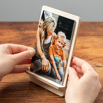 A Signature Press Print Set of family photos displayed on a maple veneer MDF stand.