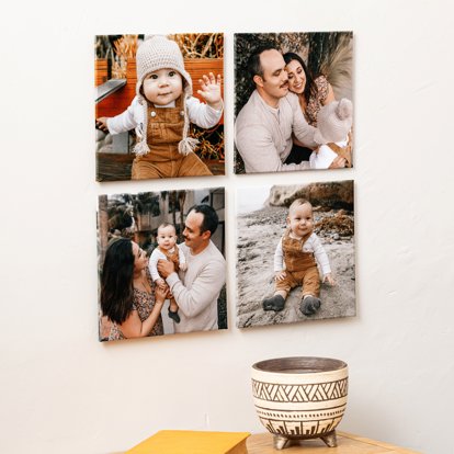 A collection of Photo Tiles displayed on a wall featuring images of a family.