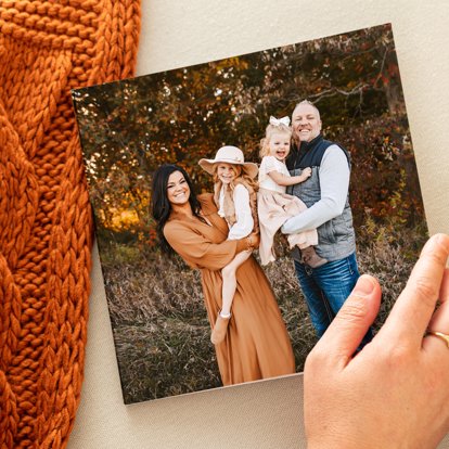 Square softcover photo book featuring a full bleed family photo on front. 