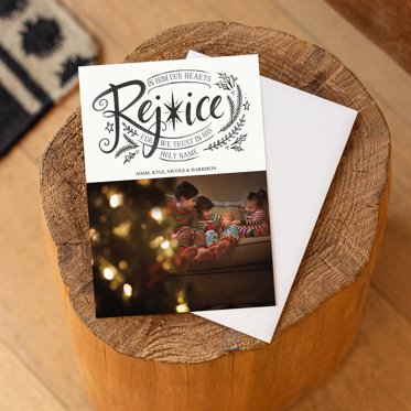 A religious christmas card from Mpix featuring a message to rejoice in green floral script on a white background and room for a large personalized photo resting on a white envelope.