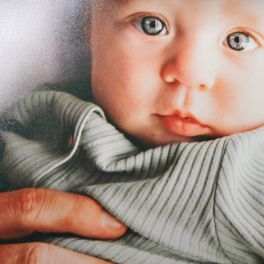 An up close view at our E-Surface lustre photo paper. This semi-gloss paper offers accurate color, lifelike skin tones, and realistic saturation.