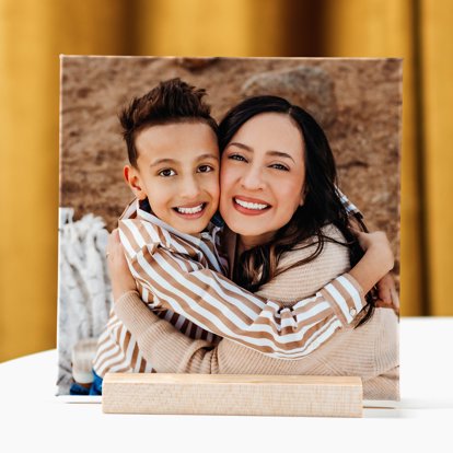 A tabletop photo tile featuring family photos.