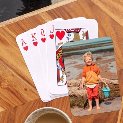 personalized playing cards laid out on a table showing off your photo on the back