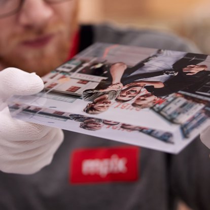 a worker at our lab inspects an acrylic photo block for quality