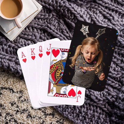 personalized playing cards laid out on a table showing off your photo on the back
