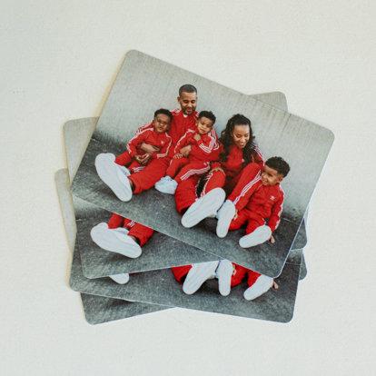 Family photo wallets stacked on top of each other with rounded corners of a holiday portrait session